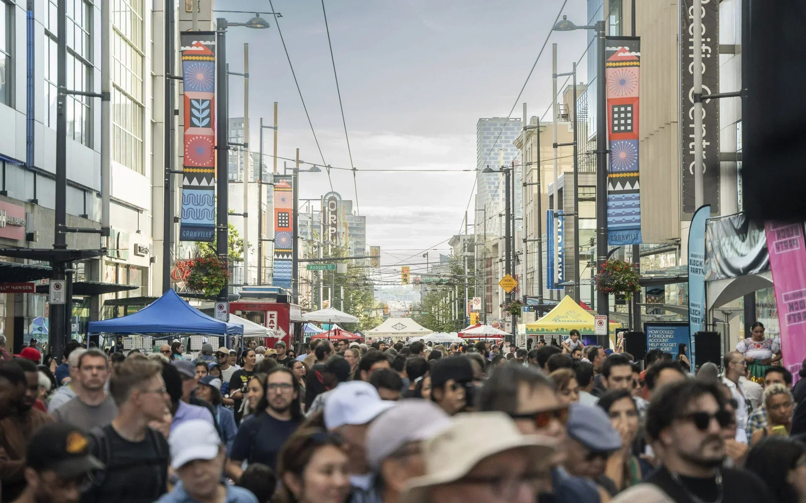Lamp Post Banners featuring Vancouver artists. Picture from: https://www.dtvan.ca/artists-of-downtown-street-banners/
