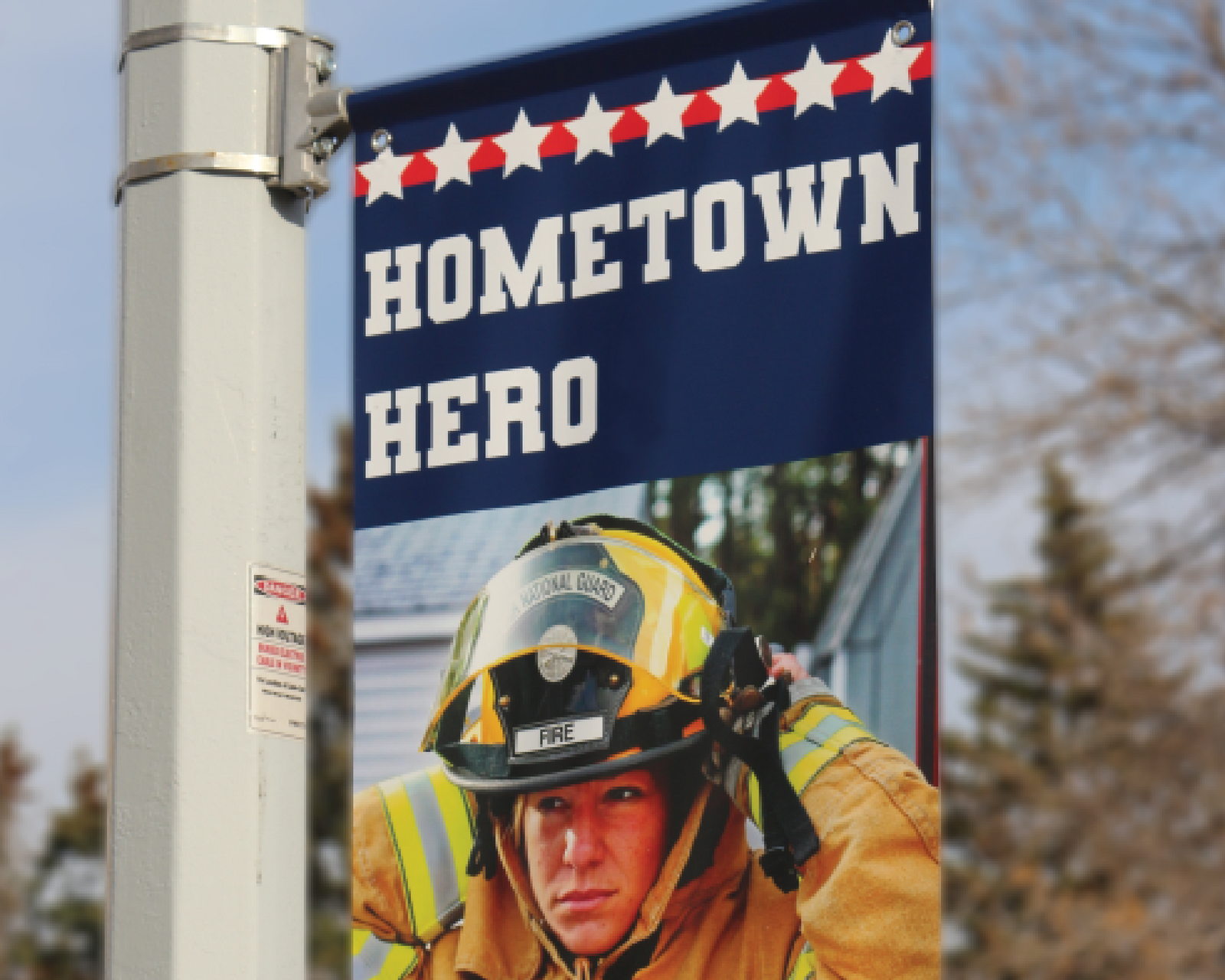 Hometown Heroes Street Pole Banner installed on Lamp Post honoring veterans and Local heroes like Police Firefighters and healthcare workers
