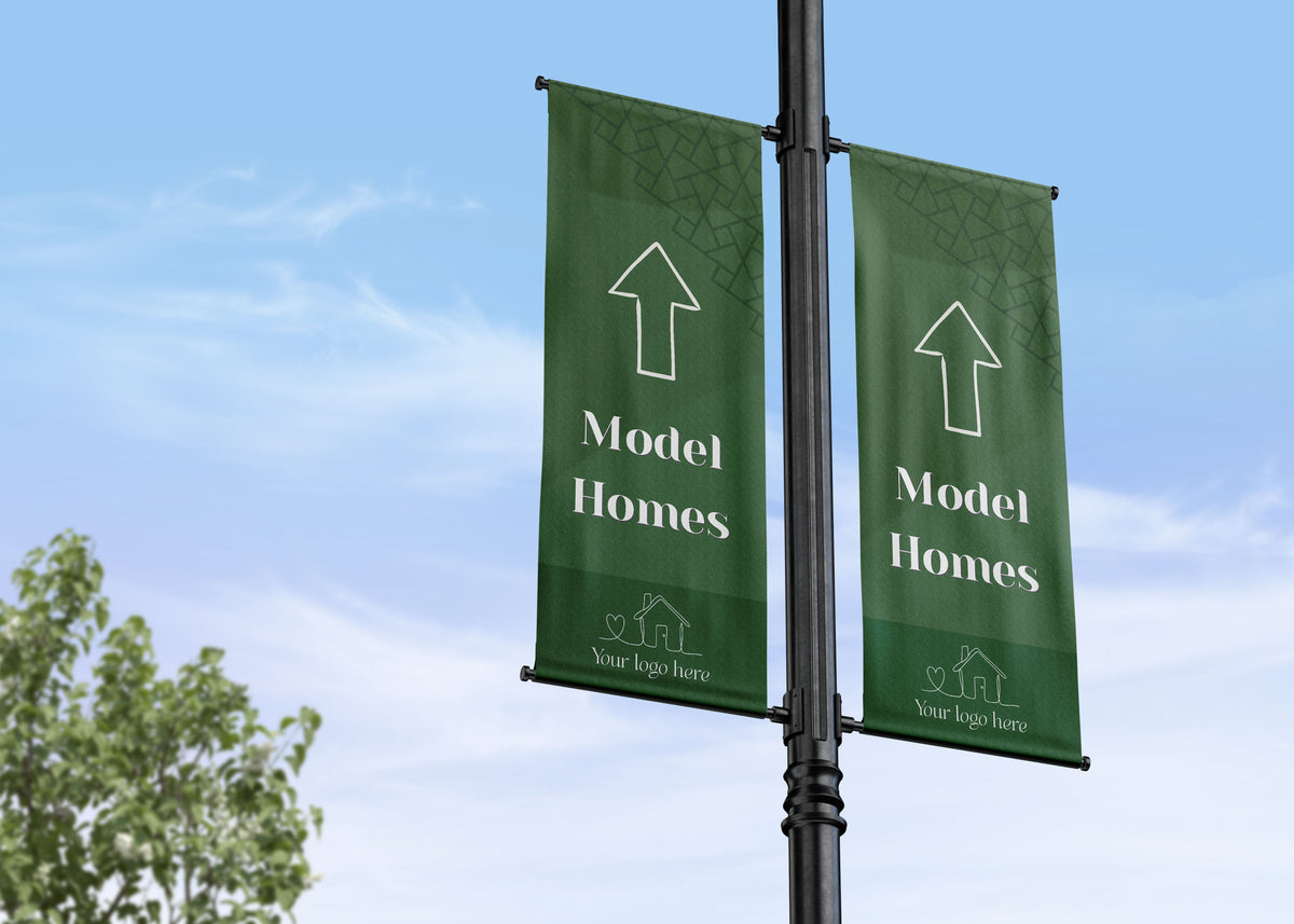Double Lamp Post banner wayfinding residential development showing the direction of the model home or show home