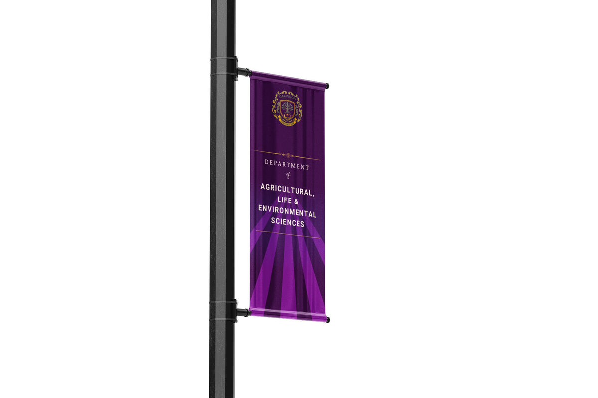 Purple banner with text and logo on a pole against a white background