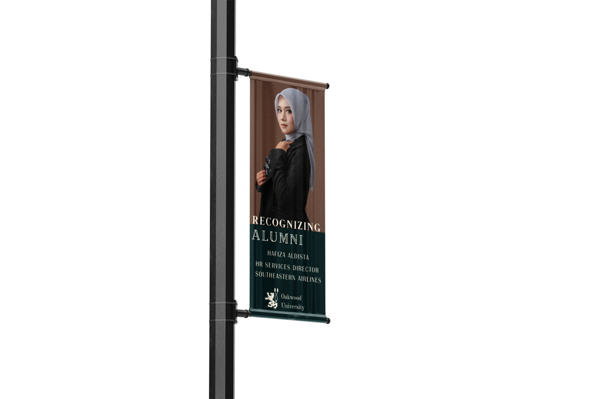 Street banner with a woman in a hijab and text on a white background