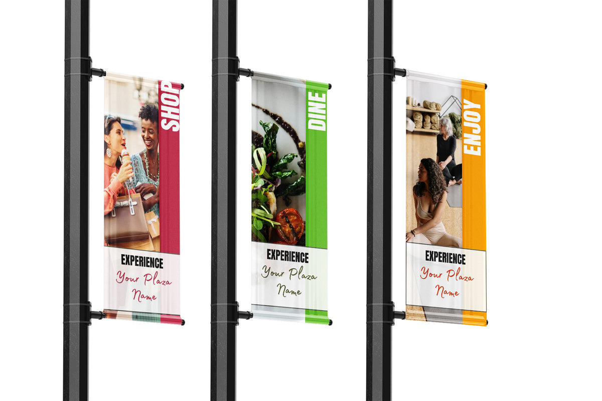 Three vertical banners on a stand with different images and text.